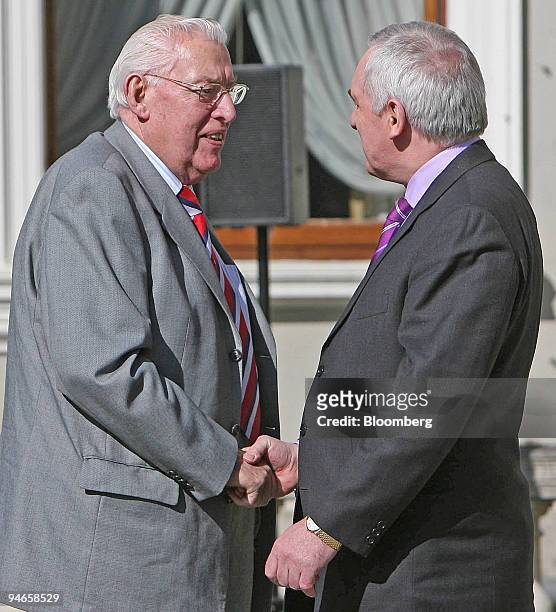 Northern Ireland,s future First Minister and Leader of the Democratic Unionist Party Ian Paisley, left, shakes the hand of Irish Prime Minister...
