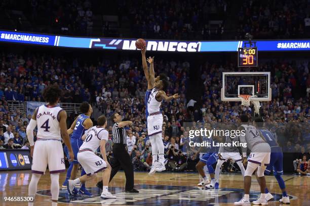 Marvin Bagley III of the Duke Blue Devils and Silvio De Sousa of the Kansas Jayhawks jump for the tip during overtime during the 2018 NCAA Men's...