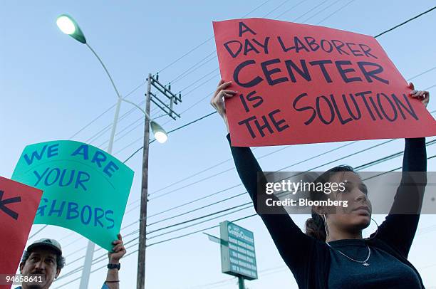 Jennifer Barbeito joins day laborer Luis Arturo Gonzalez at a protest in Gaithersburg, Maryland, Wednesday, September 20, 2006. The group is...