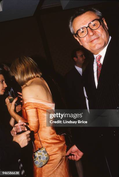 Milos Forman, joking for the camera in the humor of times past, mischievously pretends to pinch his friend Courtney Love, but is actually pinching...