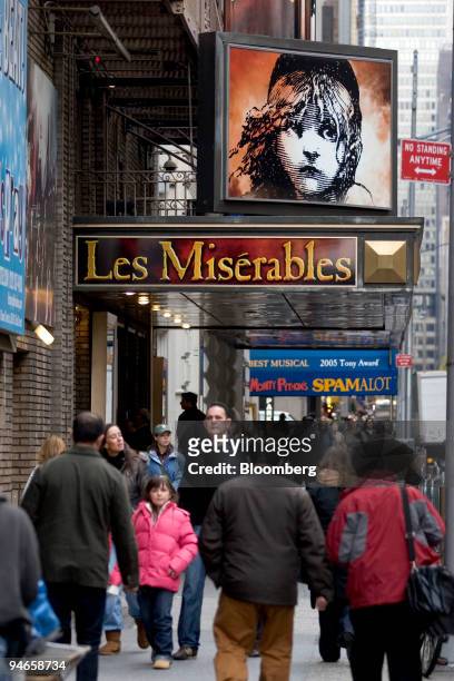 Pedestrians pass by the Broadhurst Theatre, which is currently showing "Les Miserables," in New York, U.S., on Thursday, Nov. 29, 2007. Broadway...