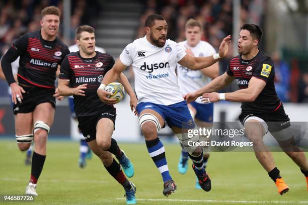 Taulupe Faletau of Bath holds off Sean Maitland during the Aviva Premiership match between Saracens and Bath Rugby at Allianz Park on April 15, 2018...