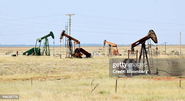 Oil pumps work in the Electra Field, just west of Wichita Falls, Texas, Tuesday, July 18, 2006. The Electra Field has been a major oil producer since...