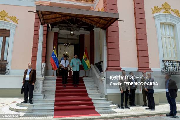 Venezuelan President Nicolas Maduro and his Bolivian counterpart Evo Morales address the media after holding a meeting, at the Miraflores...