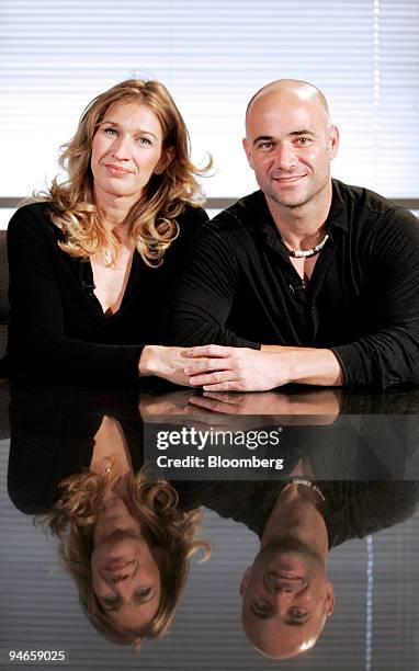 Steffi Graf, left, and Andre Agassi pose at Agassi Enterprises Inc. In Las Vegas, Nevada, Tuesday, Aug. 7, 2007. The couple, whose career tennis...