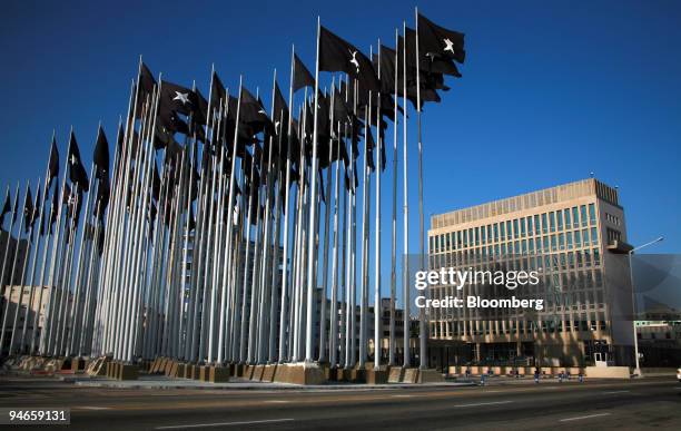 Black flags fly in 'Martyr Square' near the US Interests Section building, formerly the U.S. Embassy, in downtown Havana, Cuba, Tuesday, September...