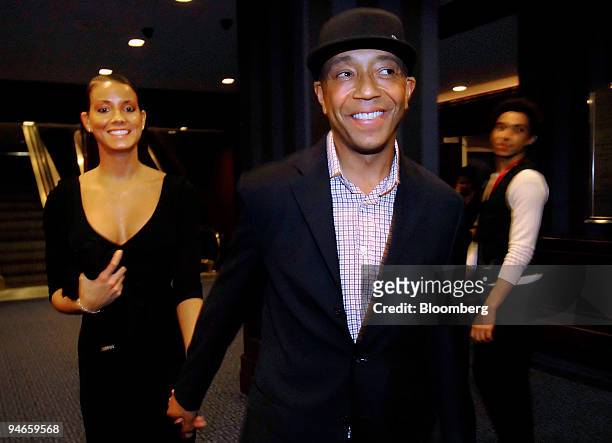Russell Simmons, chairman of Rush Communications and co-founder of Def Jam Records, right, arrives at the Alvin Ailey American Dance Theater opening...