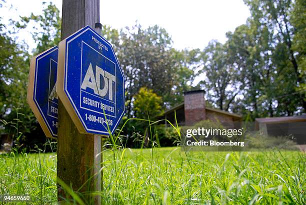 Security Service Sign An ADT Security Services sign sits on display in front of a home in ...