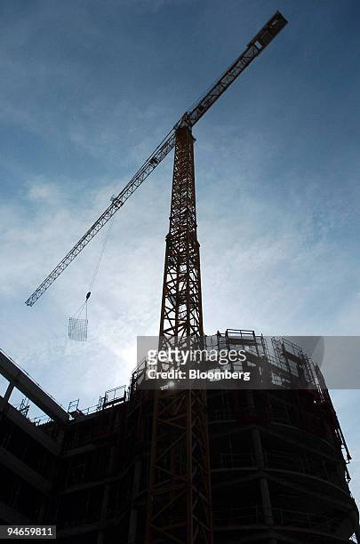 Cranes tower over an Eiffage construction is seen in Colombes, Paris, Tuesday, May 2, 2006. Eiffage announce first quarter figures on Thursday.