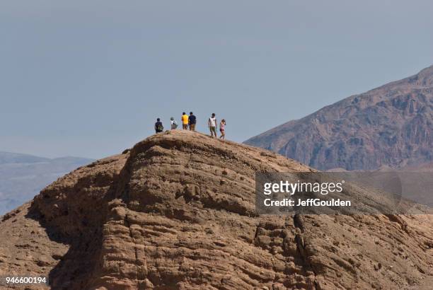 hikers on zabriskie point - jeff goulden stock pictures, royalty-free photos & images