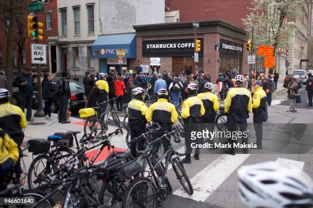 Police monitor activity as protestors demonstrate outside a Center City Starbucks on April 15, 2018 in Philadelphia, Pennsylvania. Police arrested...