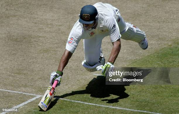 Matthew Hayden, batting for Australia, dives to make his ground on day 1 the first Ashes Test at the Gabba Cricket Ground in Brisbane, Australia,...