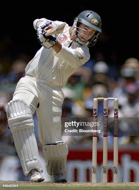 Justin Langer, batting for Australia, square drives on day 1 the first Ashes Test at the Gabba Cricket Ground in Brisbane, Australia, Thursday,...