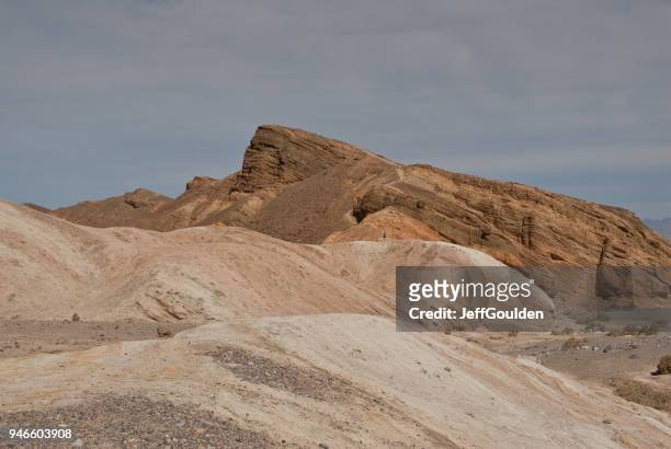 lone hiker near zabriskie point - jeff goulden stock pictures, royalty-free photos & images