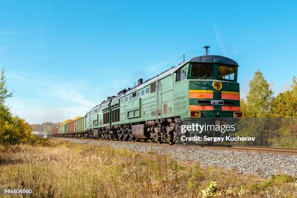 powerful diesel locomotive with freight train - boxcar stock pictures, royalty-free photos & images