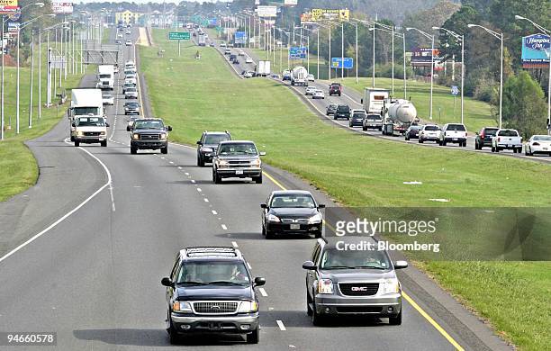 Motorists drive their vehicles along Interstate 20 in Shreveport, Louisiana, U.S., on Wednesday, Nov. 21, 2007. The American Automobile Association...
