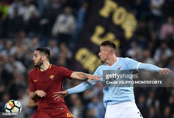 Lazio's midfielder from Serbia Sergej Milinkovic-Savic vies with Roma's defender from Greece Kostas Manolas during the Italian Serie A football match...