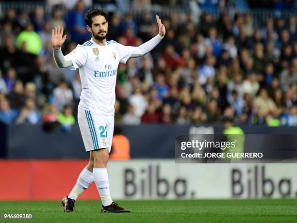 Real Madrid's Spanish midfielder Isco celebrates a goal during the Spanish league footbal match between Malaga CF and Real Madrid CF at La Rosaleda...