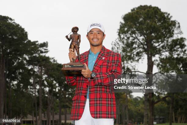 Satoshi Kodaira of Japan poses with the trophy after winning on the third playoff hole during the final round of the 2018 RBC Heritage at Harbour...