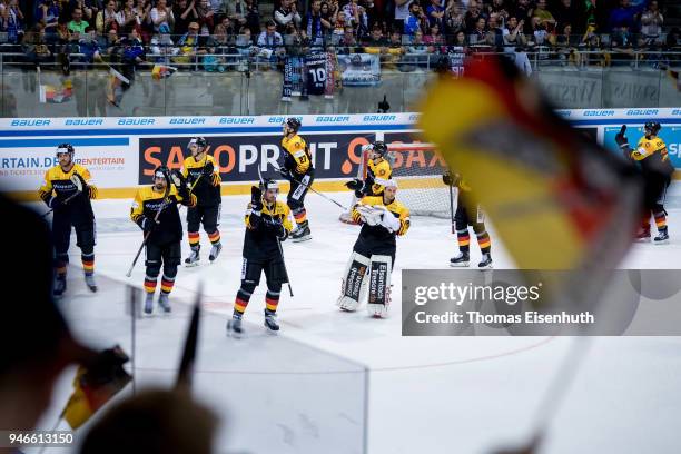 Germany's players celebrate after the international ice hockey friendly match between Germany and Slovakia at Energieverbund Arena on April 15, 2018...