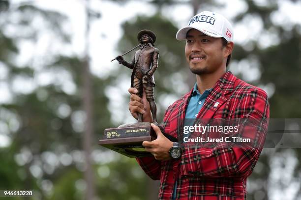 Satoshi Kodaira of Japan poses with the trophy after winning on the third playoff hole during the final round of the 2018 RBC Heritage at Harbour...