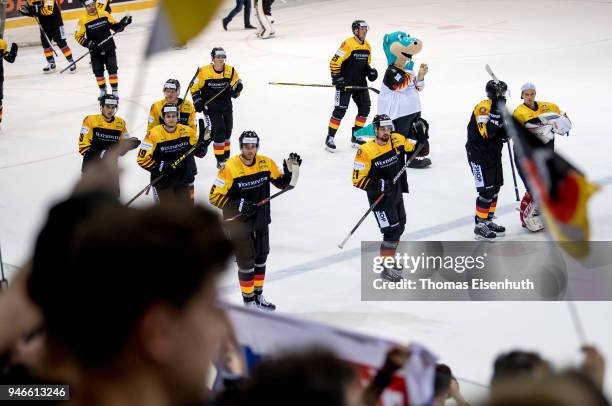 Germany's players celebrate after the international ice hockey friendly match between Germany and Slovakia at Energieverbund Arena on April 15, 2018...