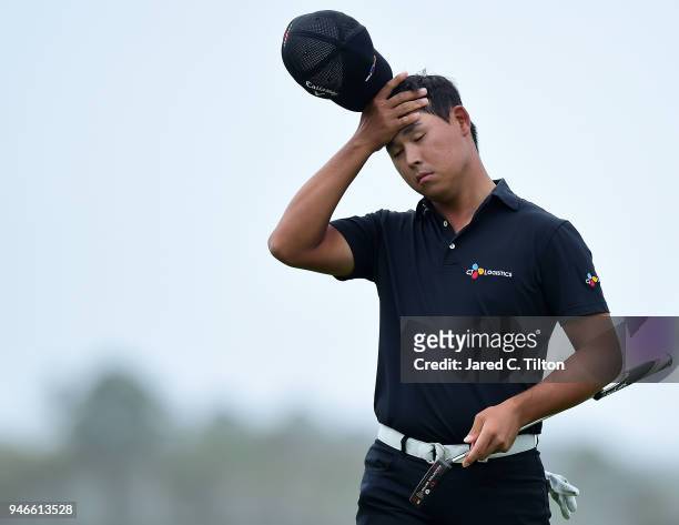 Si Woo Kim of South Korea reacts following a missed birdie putt on the 18th green during the final round of the 2018 RBC Heritage at Harbour Town...