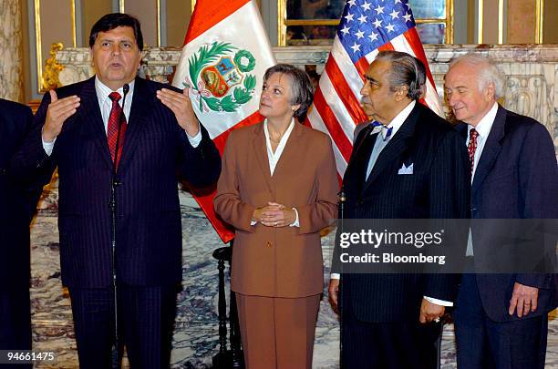 Peru President Alan Garcia, left, speaks during a news conference with U.S. Congresswoman Allyson Schwartz, U.S. House Ways and Means Committee...