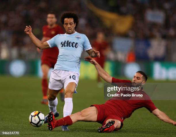 Felipe Anderson of SS Lazio competes for the ball with Kostas Manolas of AS Roma during the serie A match between SS Lazio and AS Roma at Stadio...