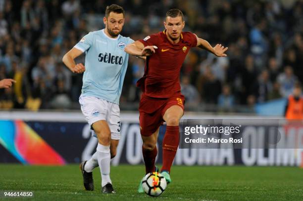 Stefan De Vrij of SS Lazio compete for the ball with Edin Dzeko during the serie A match between SS Lazio and AS Roma at Stadio Olimpico on April 15,...