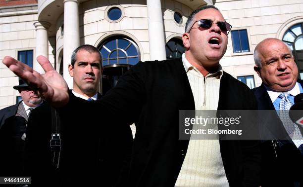 John A. "Junior" Gotti, center, son of the late Gambino family crime boss, speaks after a hearing on his tax payment status outside the Federal Court...