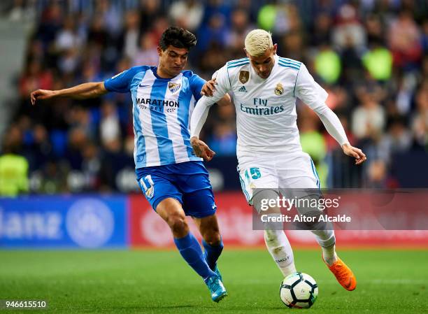 France Theo Hernandez of Real Madrid competes for the ball with Chory Castro of Malaga during the La Liga match between Malaga CF and Real Madrid CF...