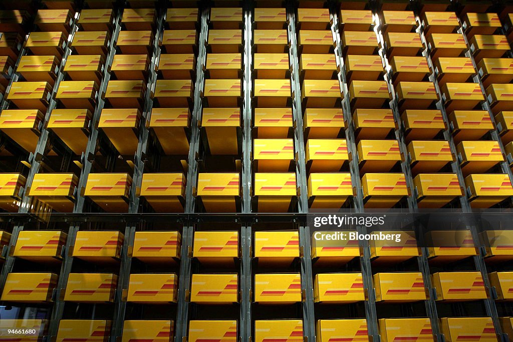 DHL packages lay in racks at the DHL Technology and Innovati