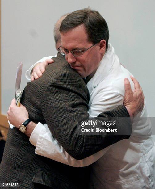 Dr. Nathan Selden, right, hugs Marcus Kerner, the father of six-year-old Daniel Kerner at Oregon Health & Sciences University's Doernbecher...