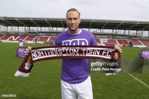 Calum Best poses with a Northampton Town scarf prior to a Celebrity Charity Match at Sixfields on April 15, 2018 in Northampton, England.