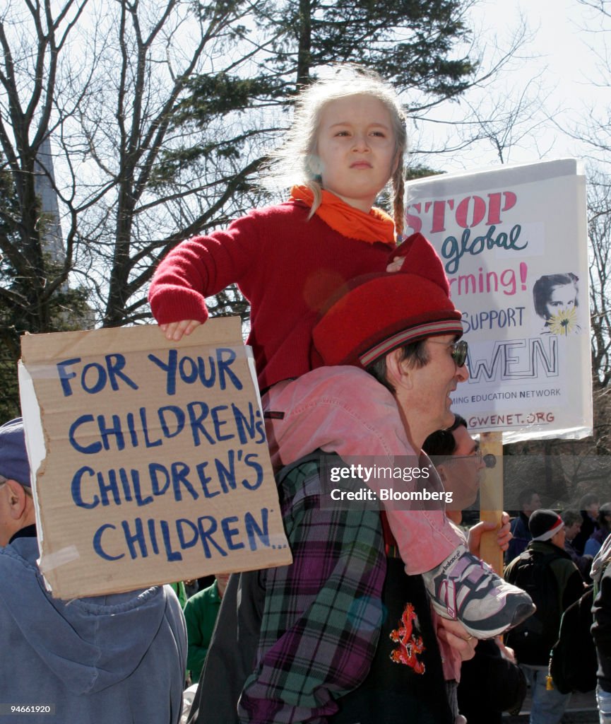 Wren (CQ) Colwell, 5, from Ripton, Vermont, sits on her fath
