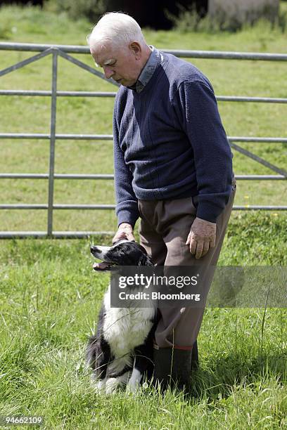 Farmer Colin Silvestre, poses with his dog at Thistledown Farm after having 14 cattle culled by DEFRA officials yesterday as a result of the...