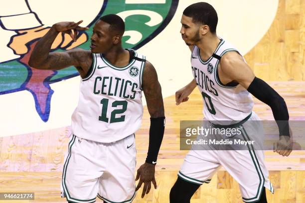 Terry Rozier of the Boston Celtics celebrates with Jayson Tatum after hitting a three point shot during the fourth quarter of Game One of Round One...