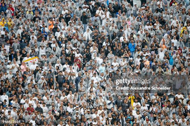 Fans of Corinthinas cheer during the match agasint Fluminense for the Brasileirao Series A 2018 at Arena Corinthians Stadium on April 15, 2018 in Sao...