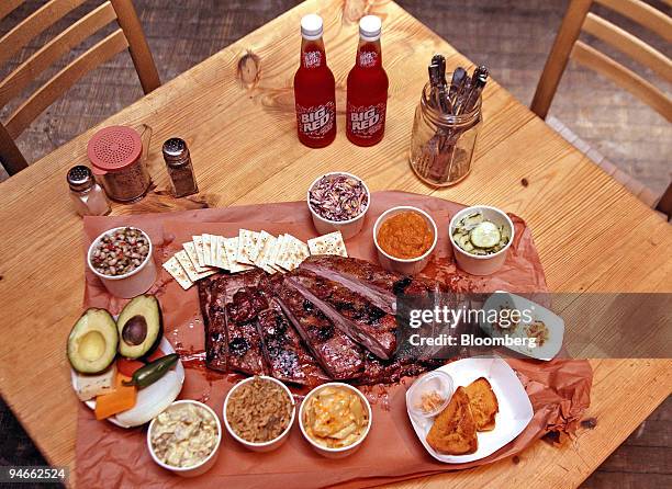Pork ribs served with black-eyed peas, texas caviar, chopped onion and roasted poblanos, confetti coleslaw cabbage with white raisins, carrots and...