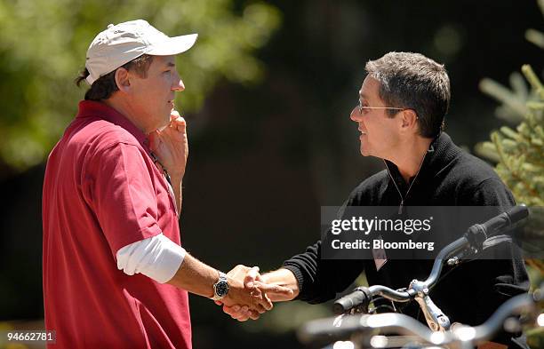 James A Wiatt, left, president and co-chief executive officer of William Morris Agency shakes hands with Brad Grey, chairman and chief executive...