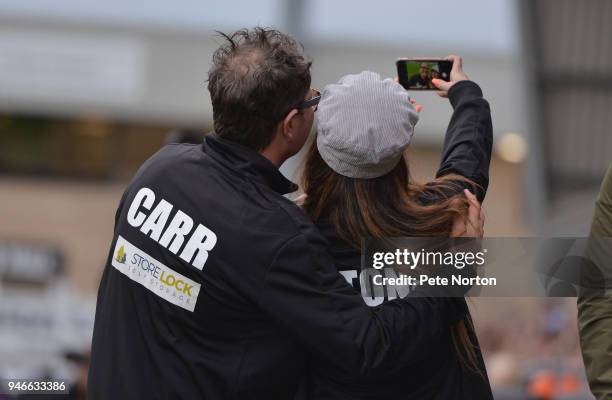 Singer Kerry Katona takes a selfie with Alan Carr during a Celebrity Charity Match at Sixfields on April 15, 2018 in Northampton, England.