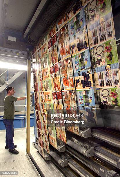 Worker operates a rotogravure printing machine at the Prinovis printing plant in Nuremberg, southern Germany, on Tuesday, April 25, 2006. Prinovis is...