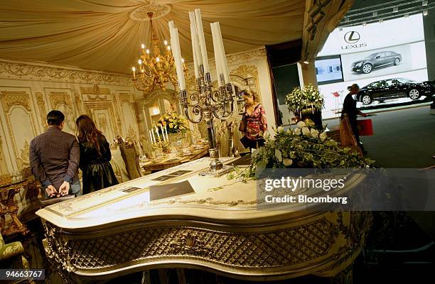 Visitors to the Russian Millionaire fair inspect one of the interior design displays, in Moscow, Russia, on Friday, Nov. 23, 2007. The third annual...
