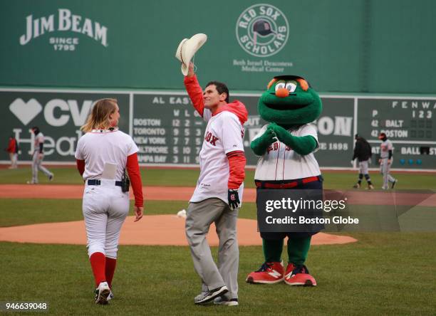 Boston Marathon hero Carlos Arredondo acknowledges the fans before throwing out the ceremonial first pitch before the Boston Red Sox play the...
