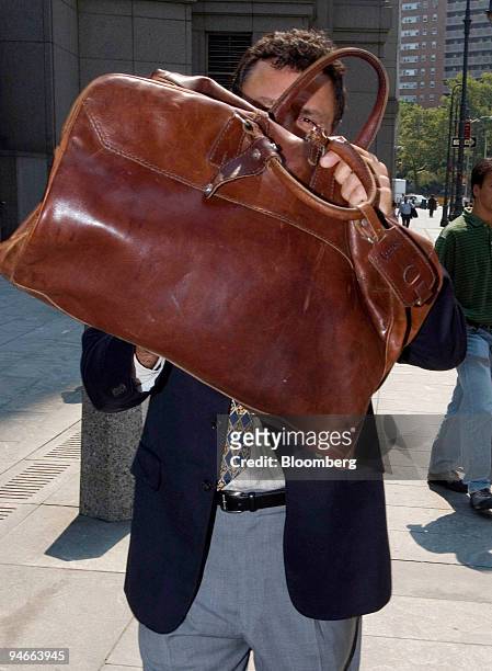 Spyro Contogouris, former freelance stock analyst and founder of MI4 Reconnaissance, leaves Manhattan Federal Court following his hearing in New...