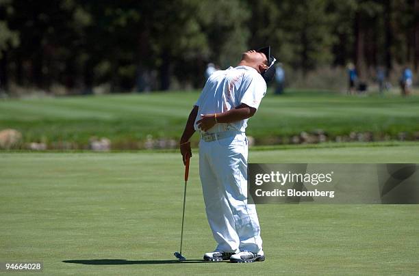 Tadd Fujikawa, a 16-year-old golfer from Hawaii, reacts after missing a putt on the 15th hole during the second round of the 2007 Reno-Tahoe Open at...