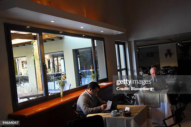 Patrons work on their laptops in the WiFi equipped bar in the Aconcagua Hotel in Mendoza, Argentina, on July 24, 2007. Theodore Roxford, also known...