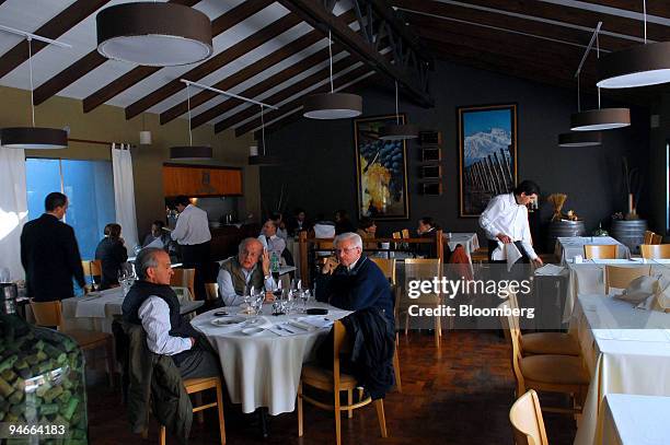Patrons dine in the restaurant of the Aconcagua Hotel in Mendoza, Argentina, on July 24, 2007. Theodore Roxford, also known as Edward Pastorini,...