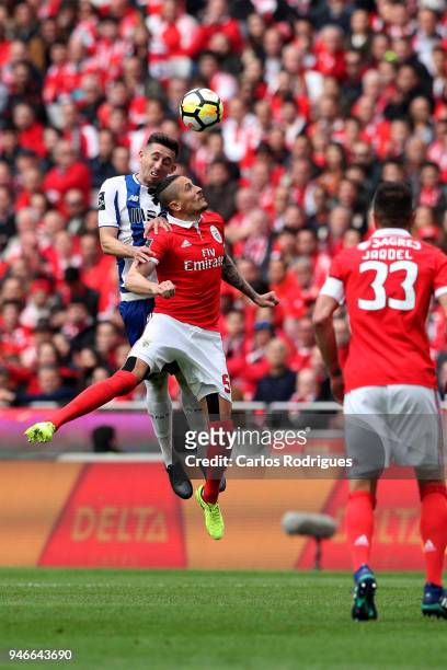 Porto midfielder Hector Herrera from Mexico vies with SL Benfica midfielder Ljubomir Fejsa from Serbia for the ball possession during the Portuguese...